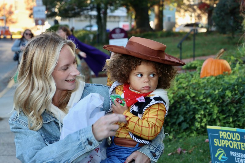 Danielle Achey, left, and Amari Allen check out some spooky decorations and costumes on Kings Highway.
