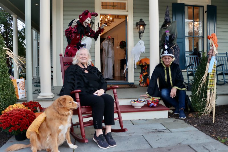 Karen and Guy Buttaro, and their dog Archie, welcome trick-or-treaters to their spooky home on Kings Highway.