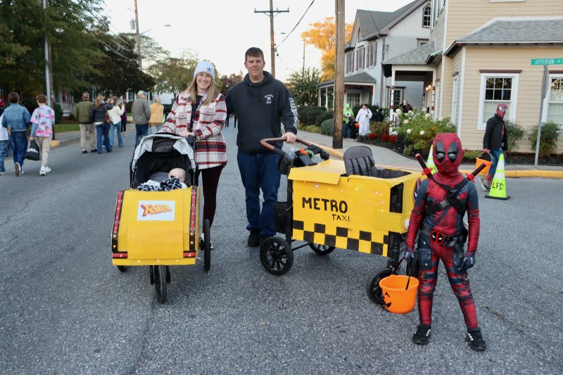 Ryan Leed, right, dressed as Deadpool to trick-or-treat on Kings Highway in Lewes. His parents Karissa and Patrick, and little brother Jackson, were also excited for the annual Halloween night party. BILL SHULL PHOTOS