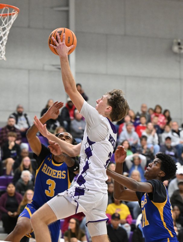 Royals junior Noah Barbrow finishes off a fast break.