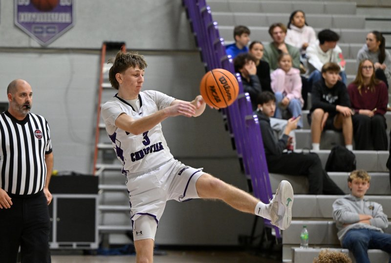 Junior Noah Barbrow saves a ball on the end line for the Royals.