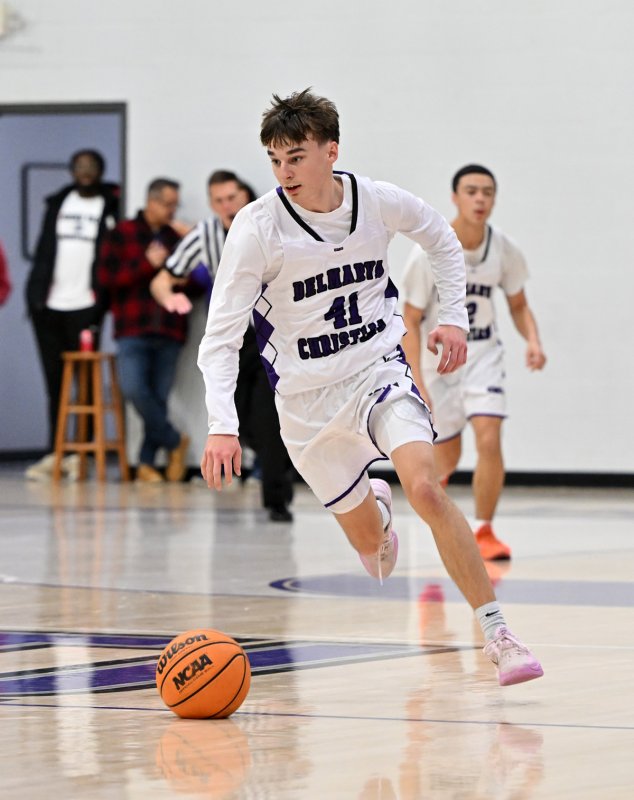 Royals sophomore guard Asher Woods speeds the ball up the court.