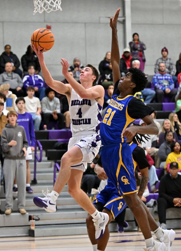 Royals junior forward Landon Jackson glides to the hoop in the opening-day loss to the Riders.