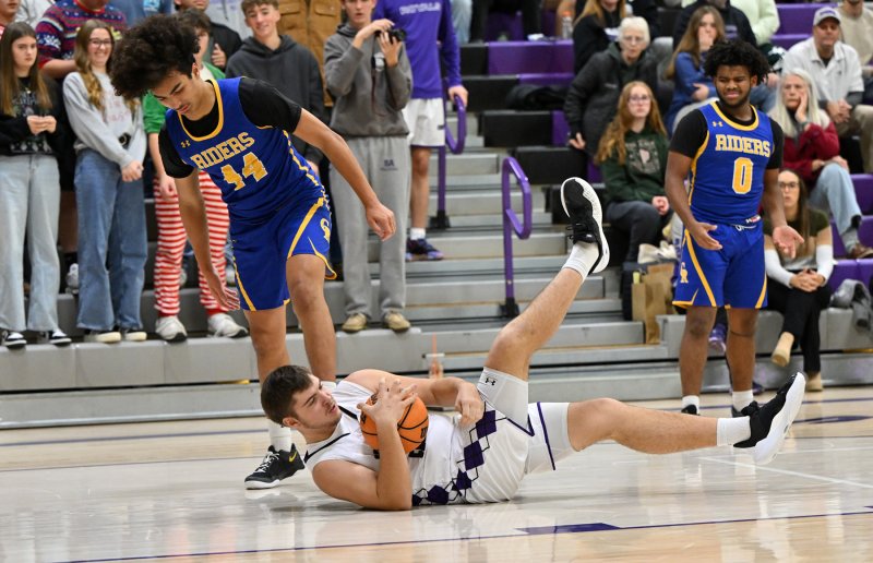 Senior forward Andrew Collins gets possession of a loose ball.