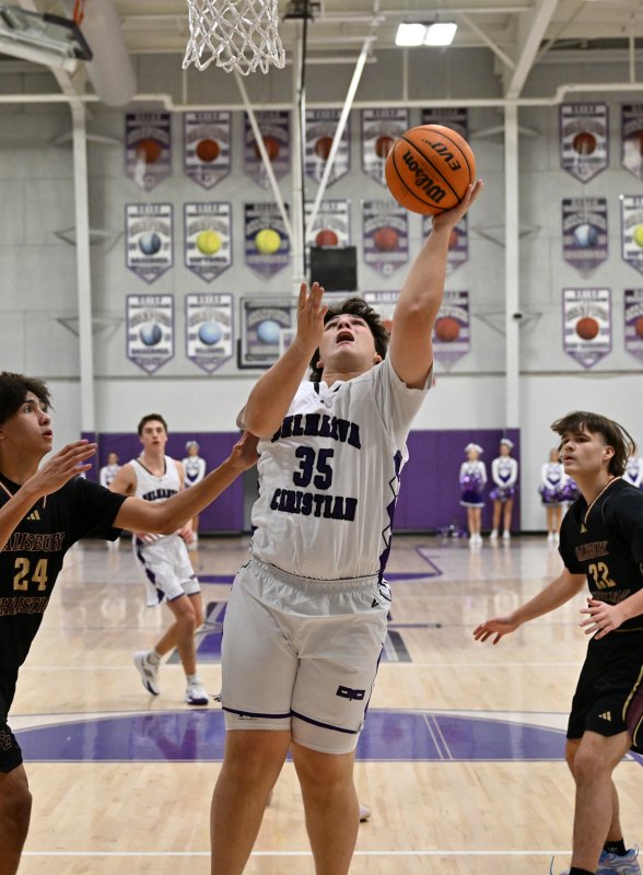 Royals junior Eric Murray hits a shot from underneath the basket.