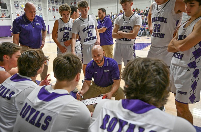 Royals coach Pat Woods reviews a fourth-quarter play.