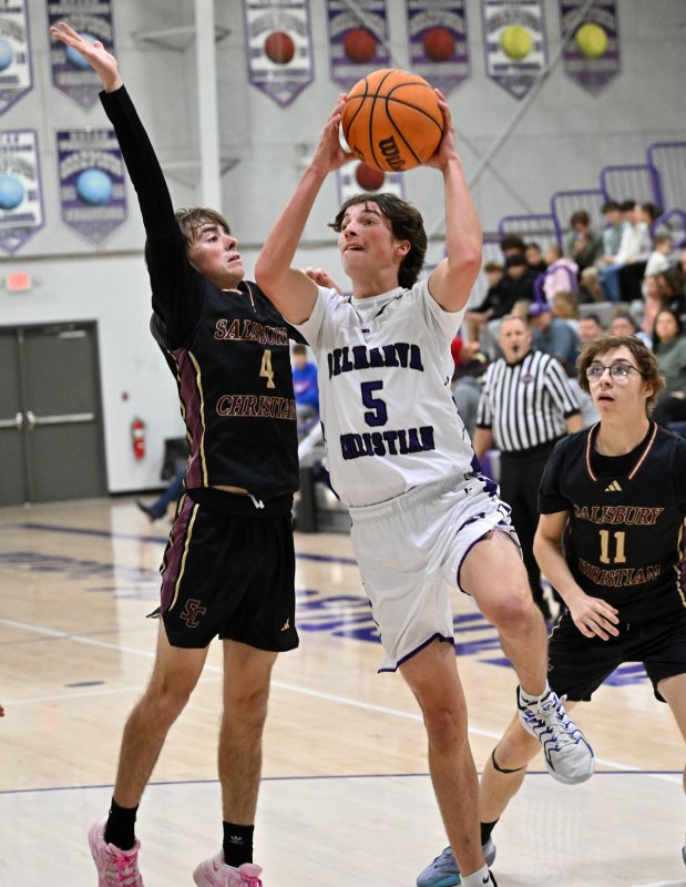 Royals junior guard Caleb Holloway goes in strong against the Jags’ Jacob Graves.