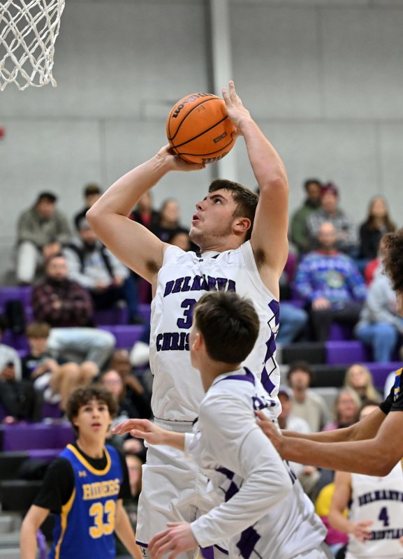 Royals senior Andrew Collins hits two of his 12 first-half points.