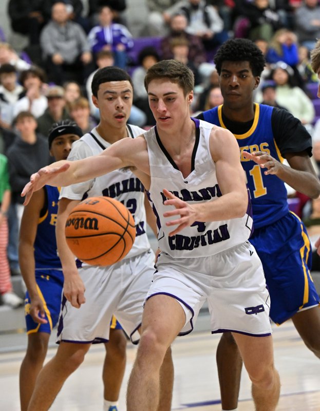 Royals junior Landon Jackson snags a loose ball in the paint.