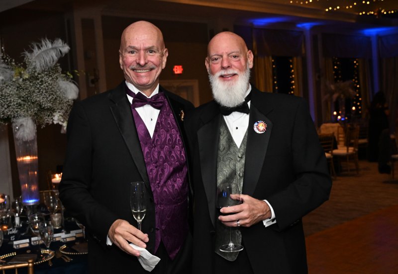 Richard Gamble, left, and Paul Lindsey enjoy a libation together.