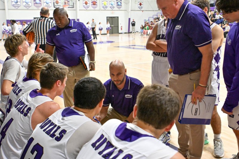 Royals head coach Pat Woods changes defense in a fourth quarter time-out.