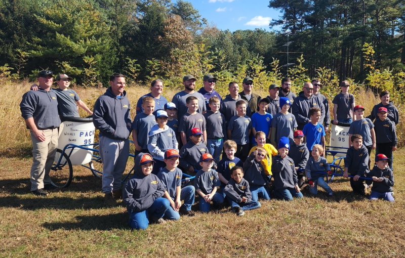 Cub Scout Pack 95 members shown at the chariot races are in back (l-r) Matt Backman, Brody Backman, Brandon Kyler, Jessica Simpson, Trevor Rathfon, Kyle Johnson, John McCarty, Eric Simpson, Matt Skidmore, Travis Caraway, Matt Goins, Chris Hilliard and Clay Beauchamp. In the middle are Nolan Wharton, Jack Simpson, Lucian Arias, Trenton Rathfon, Greyson Dorey, Keller McCarty, Sawyer Barnes, Colin Ezell, Myer Briddell, Alton Miller, Logan Baldasano and Louise Rathfon. In front are Elijah Schrock, Hayden Babcock, Dylan Hershberger, Toby Hilliard, Keagan Clemons, Brycen Mooers, Reid Goins, James Caraway, Drake Skidmore, Ridge Barnes, Kyler Kendrick and Levi Floyd. SUBMITTED PHOTO