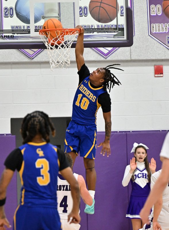 Riders sophomore Denzel Jones finishes off a CR fast break with a dunk. He finished with 21 points.