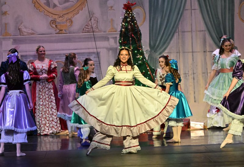 Caitlin Goodhue, 14, of Milton dances as Clara in the party scene of “The Nutcracker.” DAN COOK PHOTOS