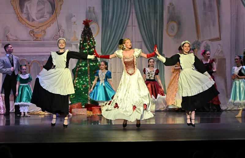 Olivia Conaway, 17, of Selbyville, as Frau Stahlbaum, dances with the maids Lannah O’Day, left, and Barbara Kissel.