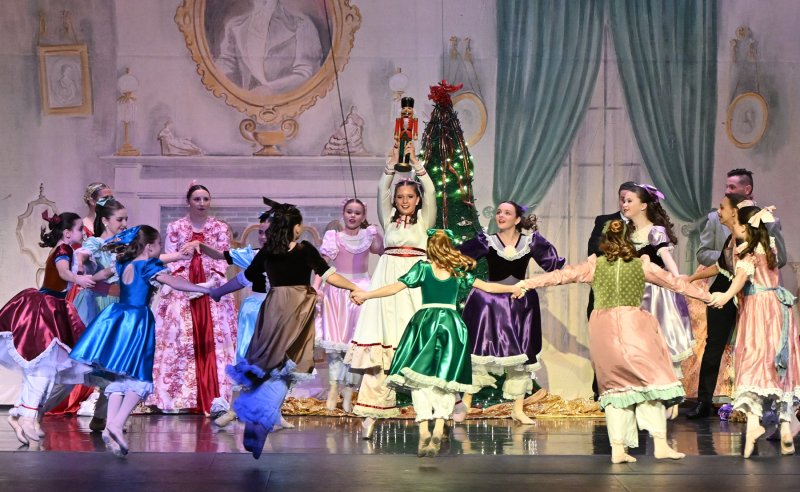 The party scene girls dance with Clara and the nutcracker.