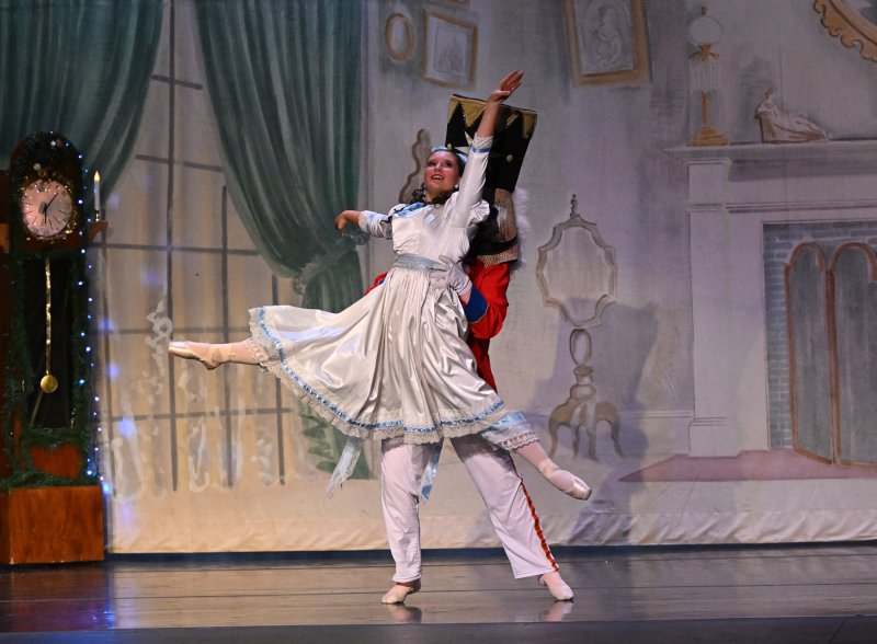 The Nutcracker, portrayed by Lannah O’Day, 14, of Georgetown lifts Clara in the battle scene.