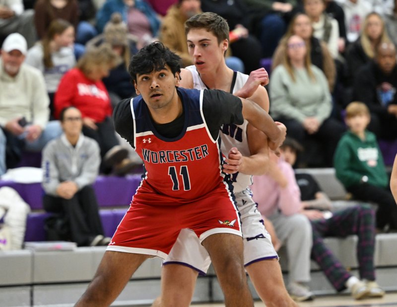 Worcester Prep senior Ansh Batra blocks out Landon Jackson.