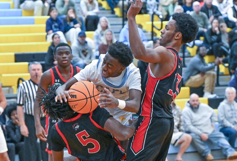 Cape junior point guard Stephen Sivels smashes through the defense, but is called for the charge.