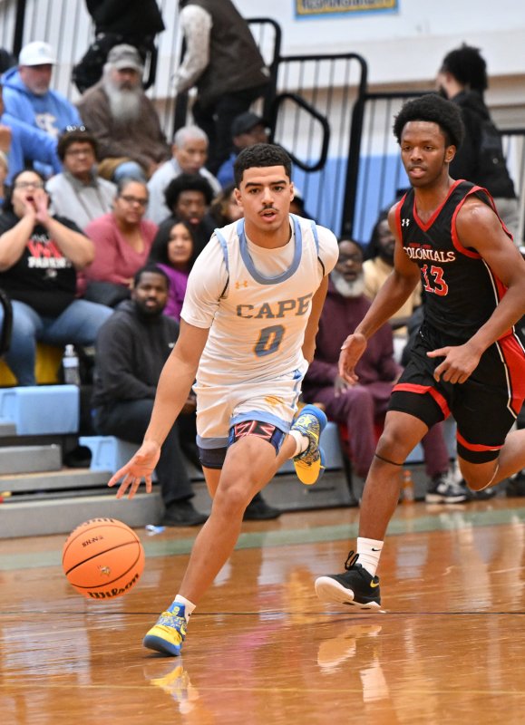 Senior Lamar McCoy speeds the ball up the court.