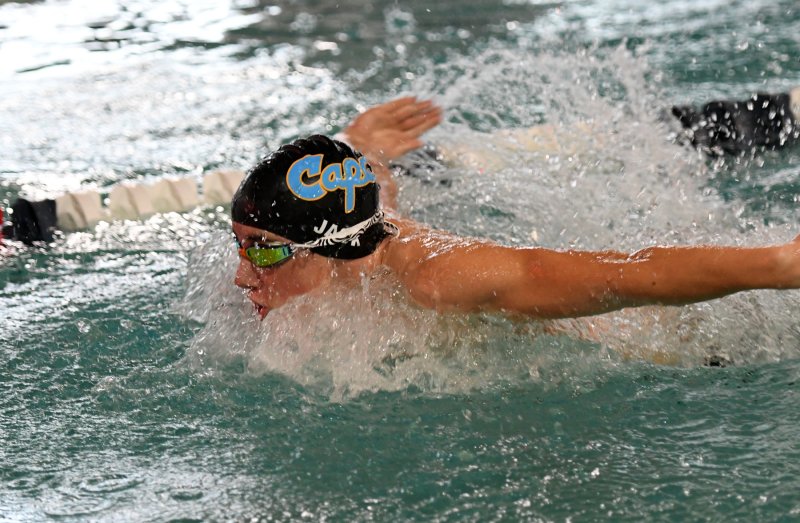 Hugh Jack swims the fly leg of the medley relay.