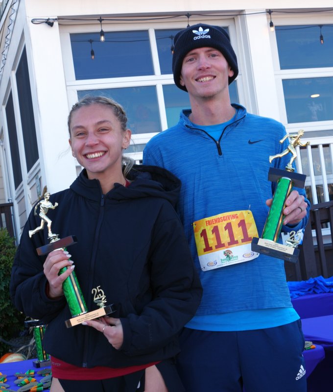 Race winners Ella Brooke Johnson and Dylan Branch show off their trophies after the Friendsgiving 5K in Lewes.