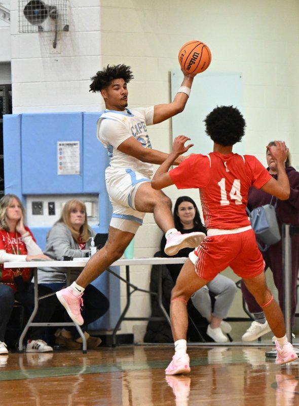 Cape senior Dell Richards saves the ball along the baseline.