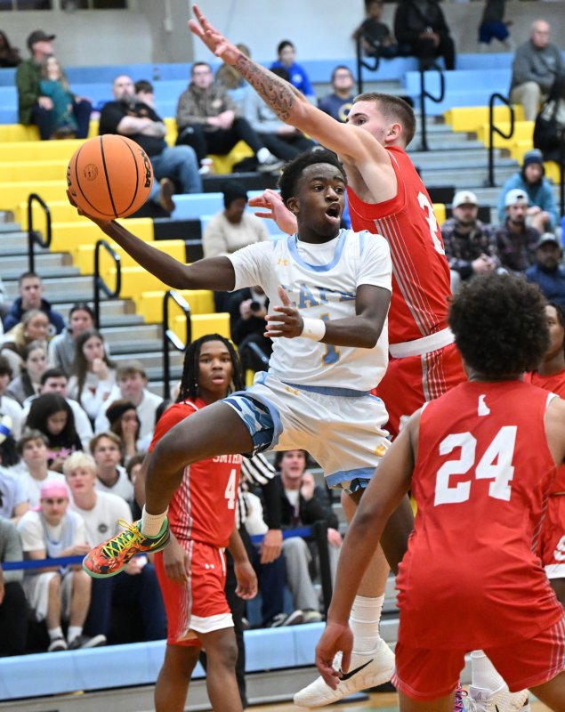 Cape junior point guard Stephen Sivels goes up and under for a pass to the paint.