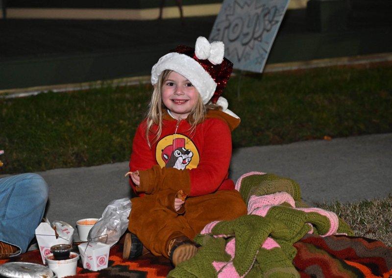 Dorothy Butcher, 5, arrived early and had her dinner before the parade.