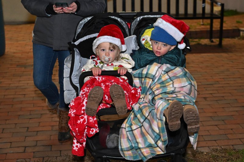 Thorin, 1 1/2, and Magnus Modesto, 3 1/2, await the parade.