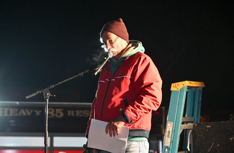 The Honorable John (Jack) R. Hudson emcees the parade.