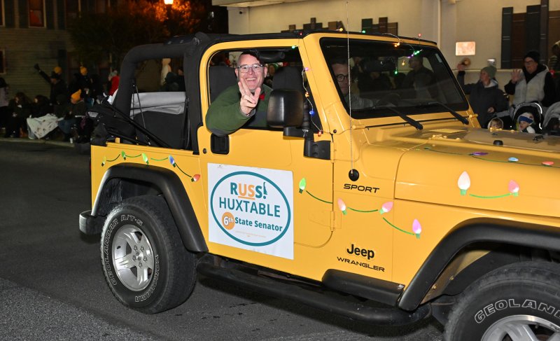 Sen. Russ Huxtable, D-Lewes, waves to the crowd.
