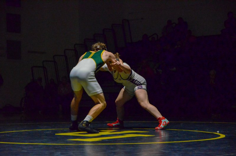 Seahawks senior Talah Patton locks horns at the start of her match.