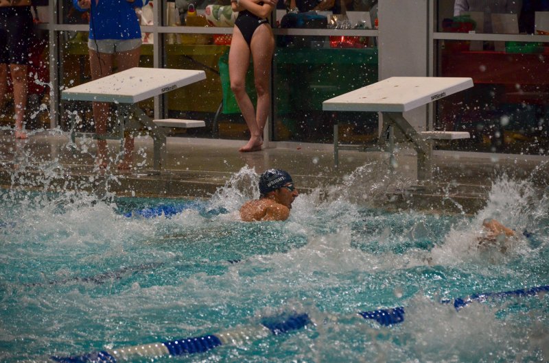 Sussex Academy senior Christian Wright splashes into the wall at 22.66 to win the 50 freestyle in the 77-73 loss to Caesar Rodney Dec. 5. AARON R. MUSHRUSH PHOTOS