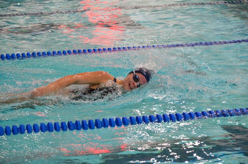 The always-smiling Victoria Evans is just taking a breath here, but she smiled plenty when she wrapped up her first-place finish in the 100 freestyle.