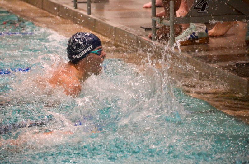 Sussex Academy senior Kieran Probert celebrates winning the 400 freestyle for his team by chasing down the lap leader during his leg.
