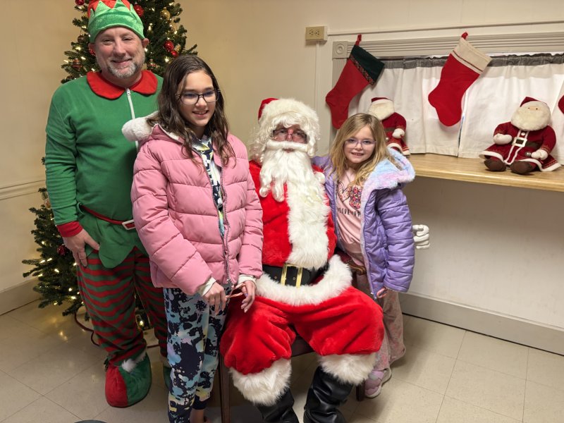 Among the kids visiting Santa are Redden Absher, left, and Laklyn Asher. RYAN MAVITY PHOTOS