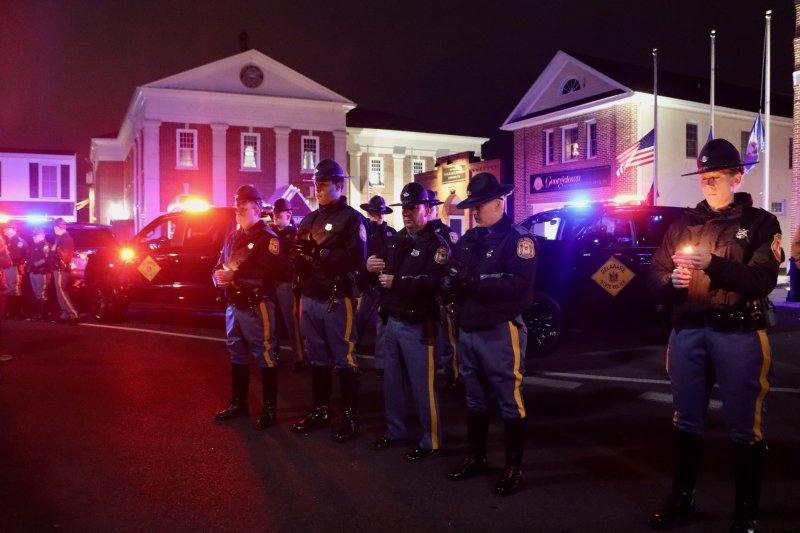 State troopers and law enforcement vehicles wrap around the Circle in tribute to Cpl. Matthew T. “Ty” Snook.