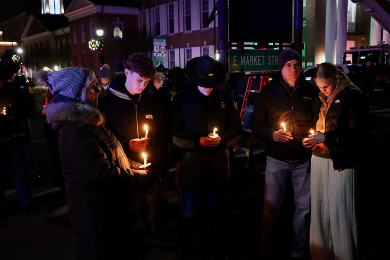 Members of the law enforcement community join family and friends to remember Cpl. Matthew T. “Ty” Snook at the vigil.