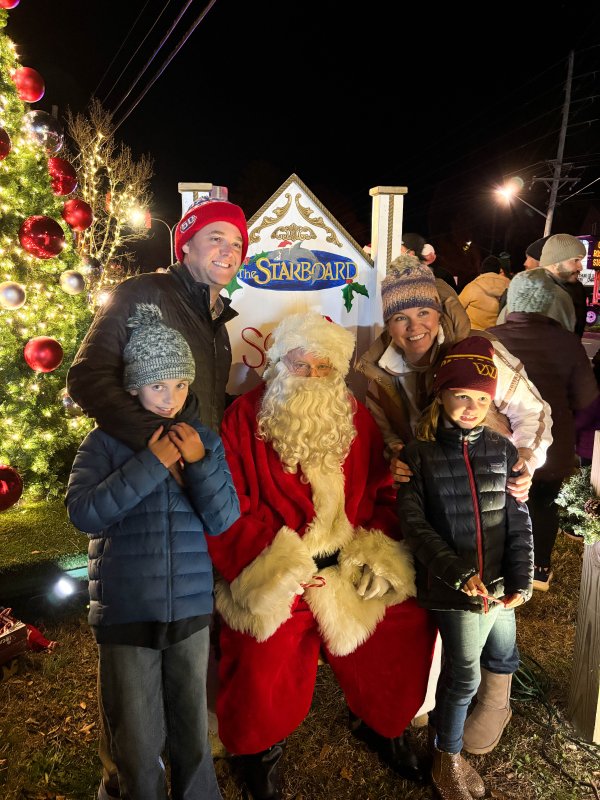 The Finlay family meets Santa Claus at the Fifer’s Farm Kitchen tree lighting. In back are J.P., left, and wife Lauren. In front are daughters Shelby, left, and Ainslie.