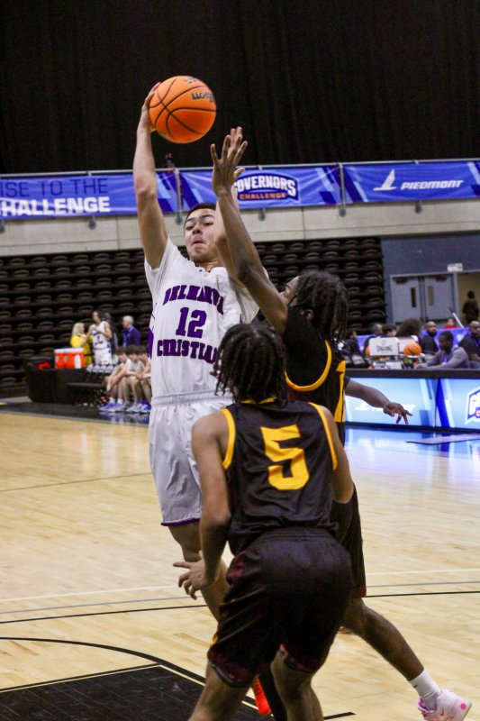 Delmarva Christian freshman Aarian Tucker throws a no-look pass.