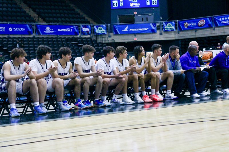 Delmarva Christian’s bench encourages the team to tighten up on defense.