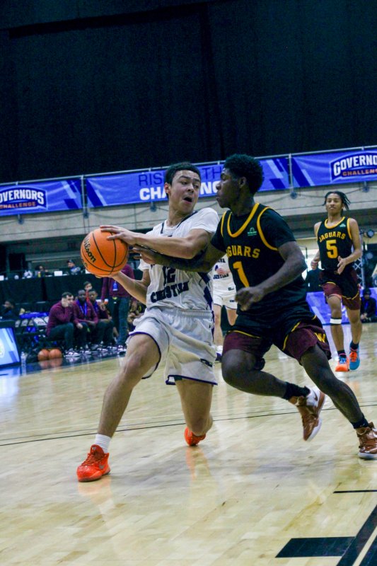 Delmarva Christian freshman Aarian Tucker tries to keep his hands free.