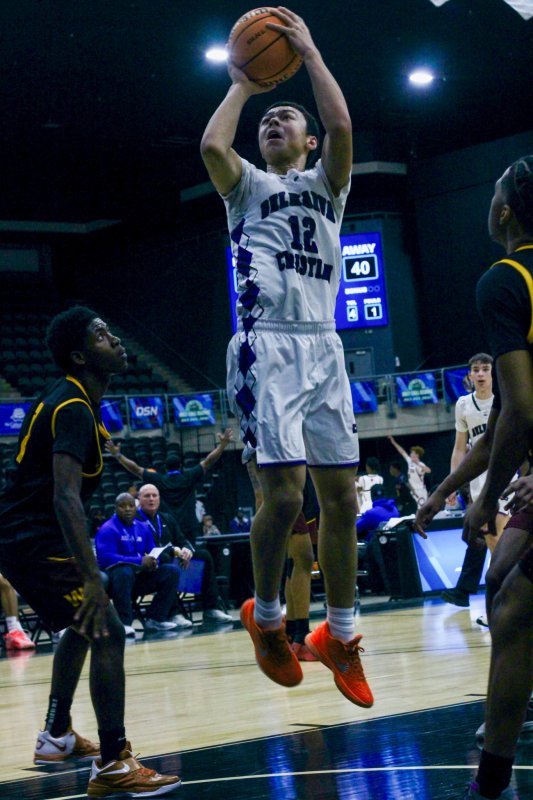 Royals freshman Aarian Tucker gets free for a shot after being fouled on his ascent.