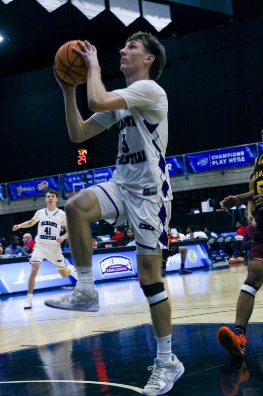 Delmarva Christian junior Noah Barbrow heads up for two of his game-high 18 points.