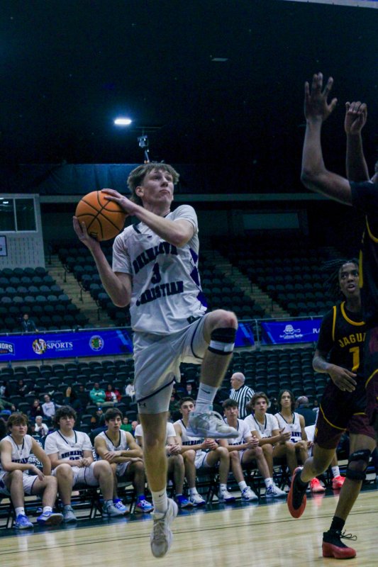 Delmarva Christian junior Noah Barbrow rises up to finish his baseline drive at the cup.