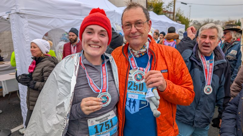 While John Newsam finished his journey at the Rehoboth Beach Marathon, Madison Dullea, left, completed her ninth race of her 50 for 50 trek.
