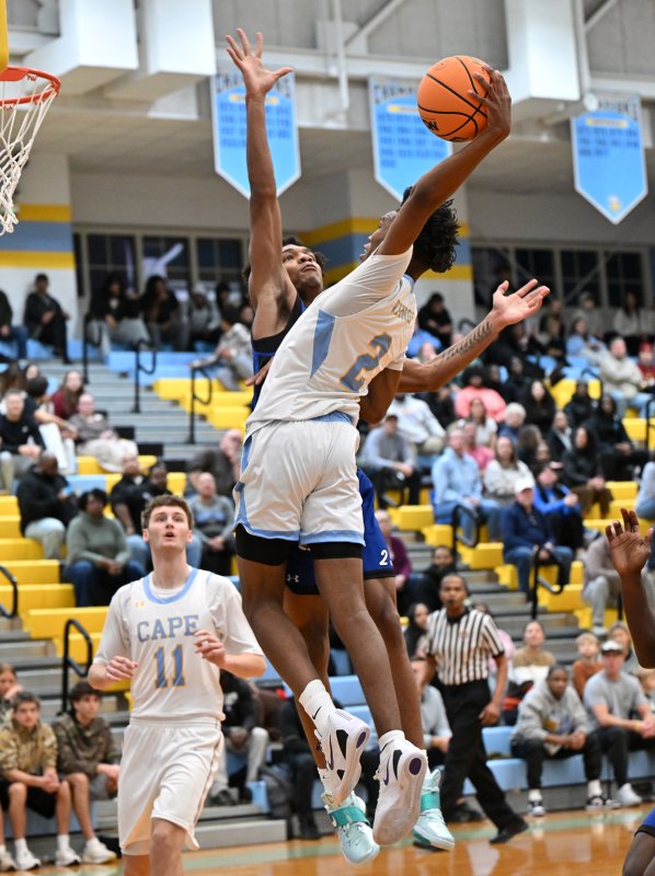 Cape junior Geordan Downing goes in for a dunk attempt.