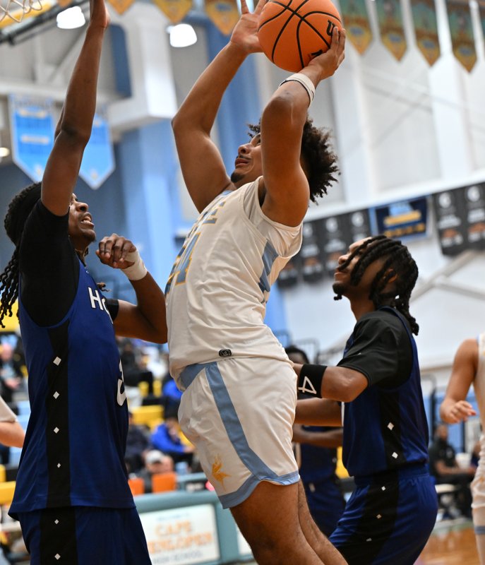 Cape senior Dell Richards crashes the boards.