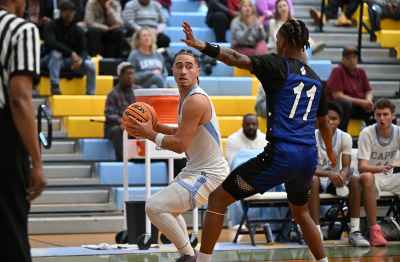 Cape junior guard Jameson Tingle looks to pass to the paint to David Barnes.